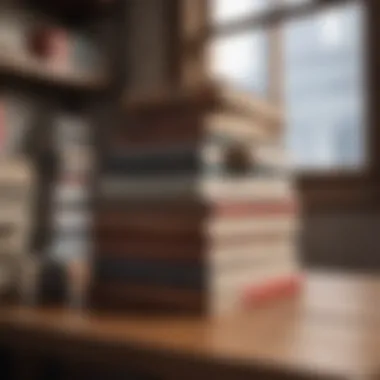 A stack of renowned financial growth books on a wooden table