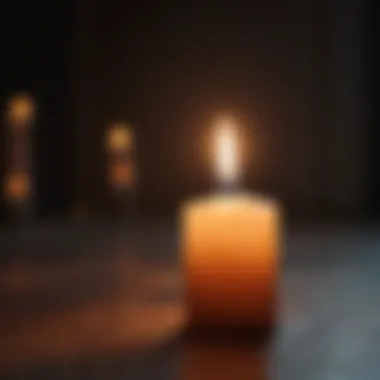 A close-up of a candle illuminating a dark room