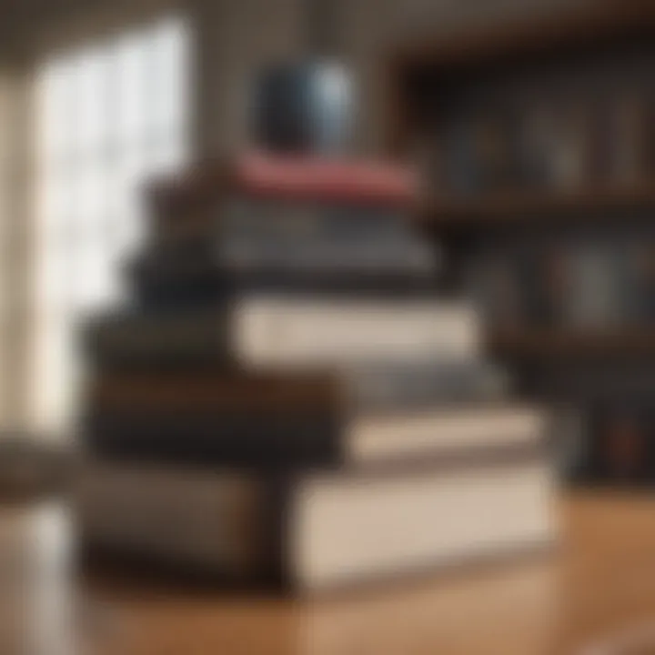 Stack of diverse investing books on a wooden desk