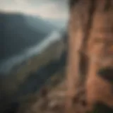 A person standing at the edge of a cliff, gazing into the distance, symbolizing bravery and the unknown.